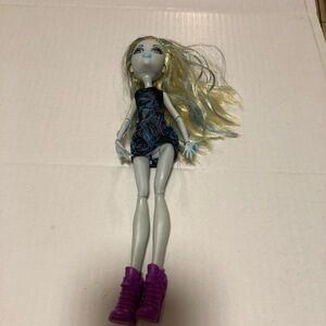 Mattel Doll with Blonde Hair and Purple Boots